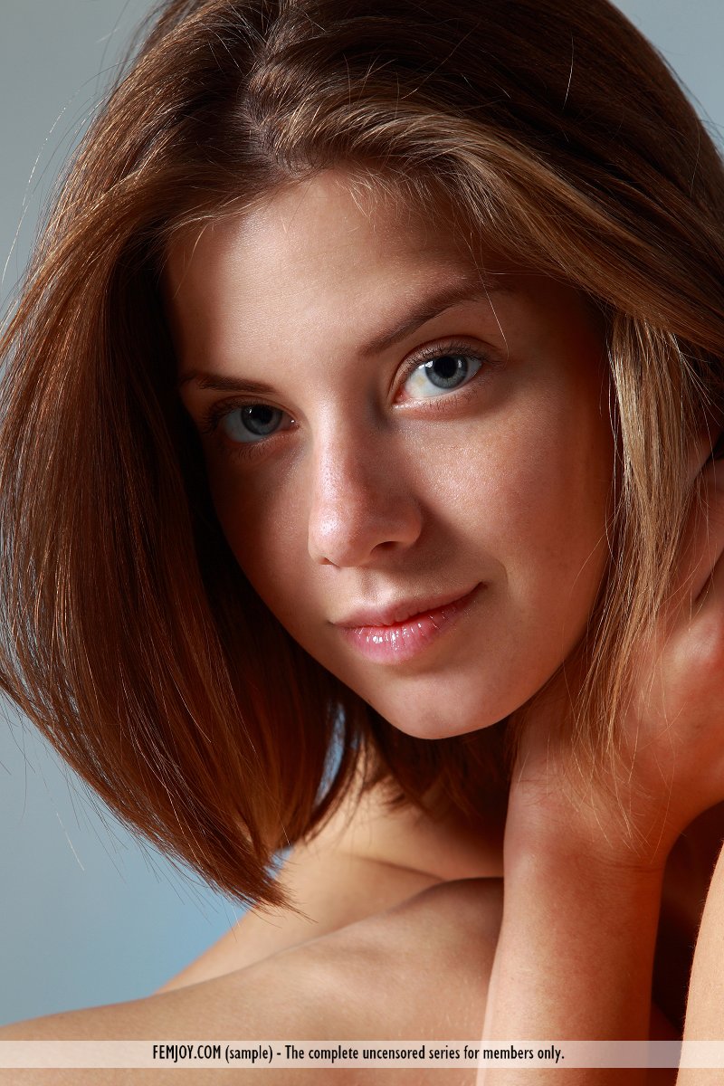 This girl has undraped large breasts and Brown hair, Hazel eye