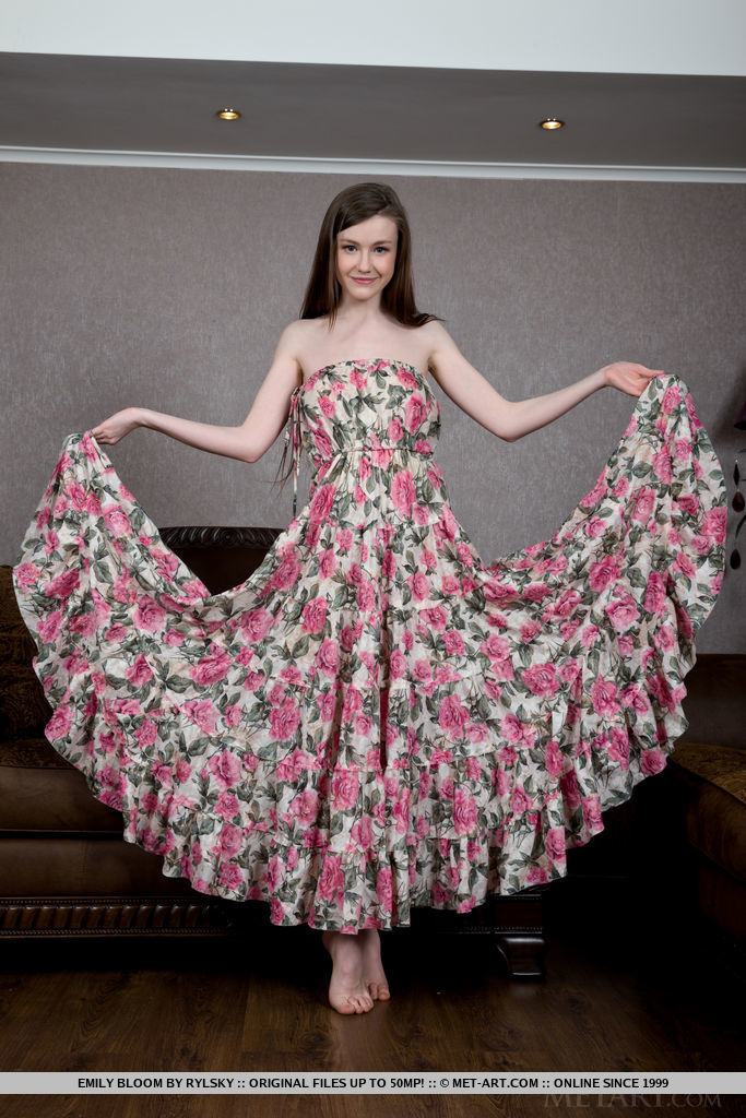 Emily Bloom presents itself in a colorful floral dress